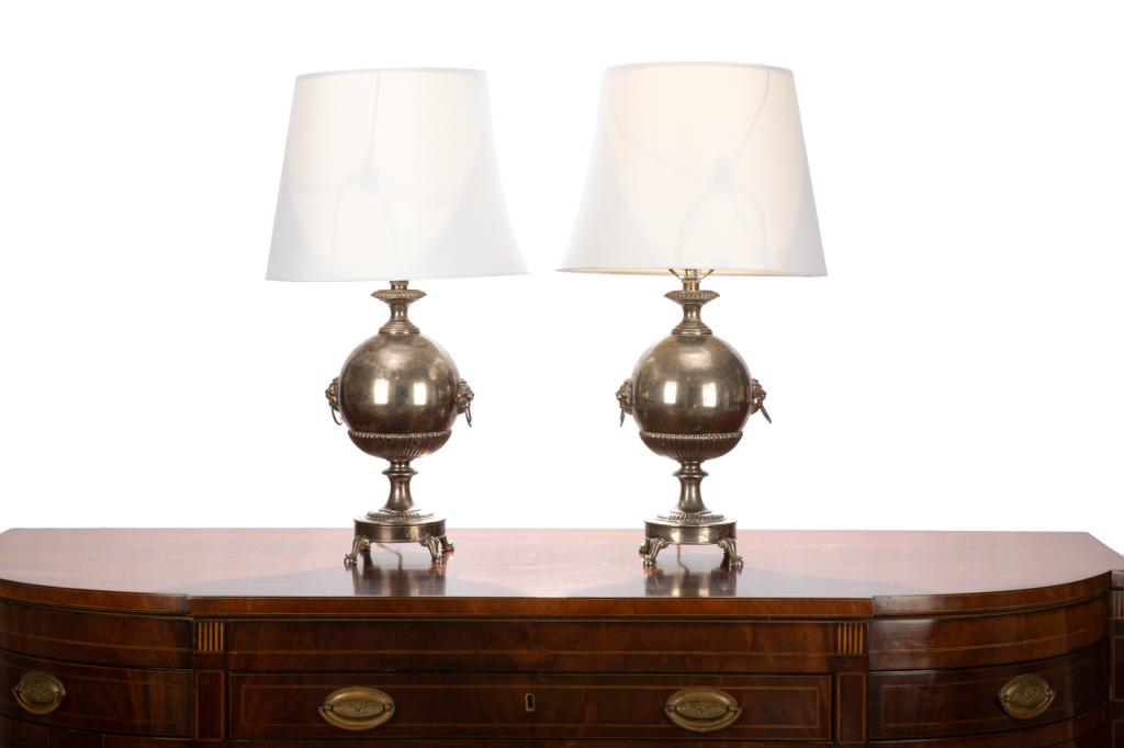 PAIR OF EDWARDIAN SAMOVAR FORM LAMPS: Of a typical 19th C. form with applied lion mask handles, raised on four cast feet. H. to finial: 25 1/2 in.