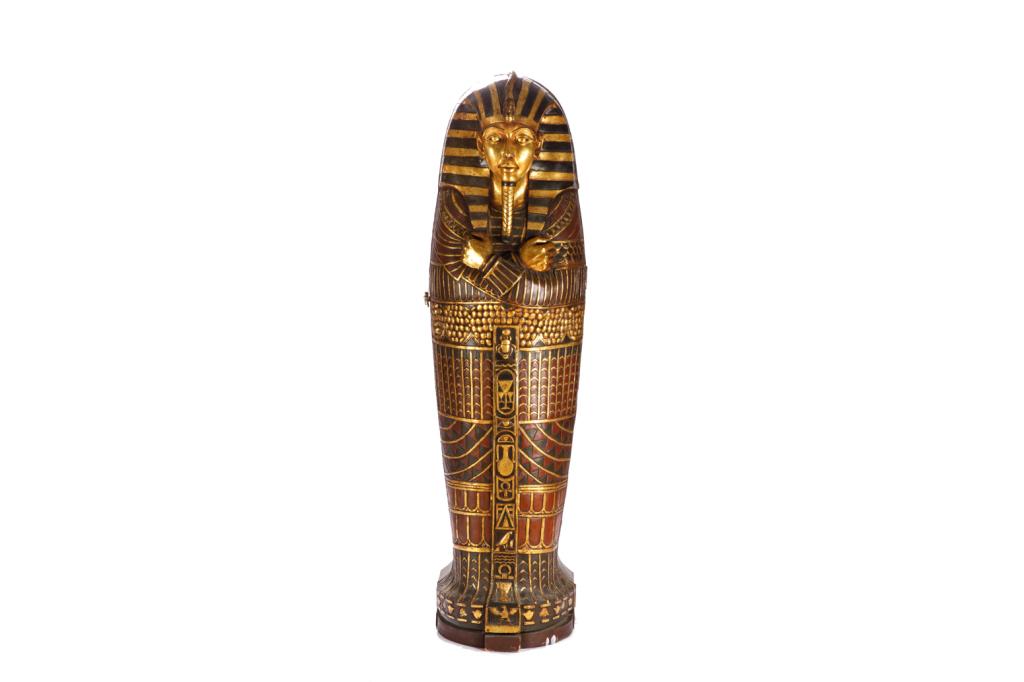 CONTEMPORARY POLYCHROME MODEL OF A SARCOPHAGUS: Exaggerated Egyptian decoration, life size. Opens to reveal a shelved interior. Modelled after the gold sarcophagus of King Tut. H. 75 x W. 21in.