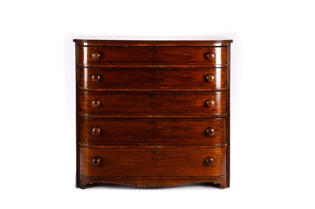 GEORGE III MAHOGANY FIVE DRAWER CHEST: With bowed front and turned wood handles, ebonized banding, English, early 19th C. H. 42.5 W. 44 D. 23.5 in.