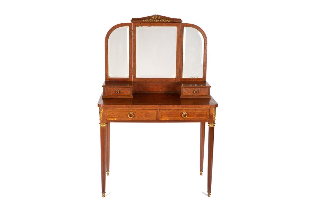 FRENCH BURLED WALNUT MIRRORED VANITY TABLE: With two drawers and bronze mounts. Together with a central mirror and two adjustable side panels. First half 20th C. H. 58 W. 37 D. 19 1/2 in.