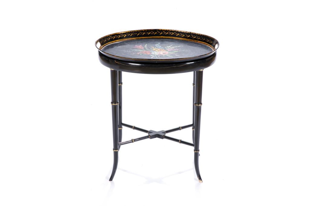 CONTEMPORARY TOLE PAINTED TRAY TABLE: Black lacquer with gilded embellishment. Tray with raised edges and painted central floral bouquet. Together with bamboo style legs and x-form stretcher. H. 23 W. 20 D. 15 in.