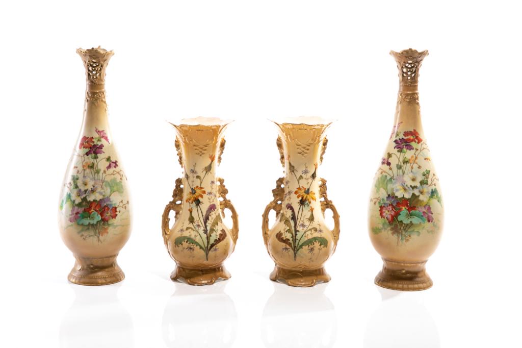 TWO PAIRS OF AUSTRIAN PORCELAIN VASES: Four hand painted Austrian porcelain vases, each with floral decoration and gilded accents. Three of the four have Turn EW mark to base. The smaller two with marks for Ernst Wahliss, Vienna (1897-1906