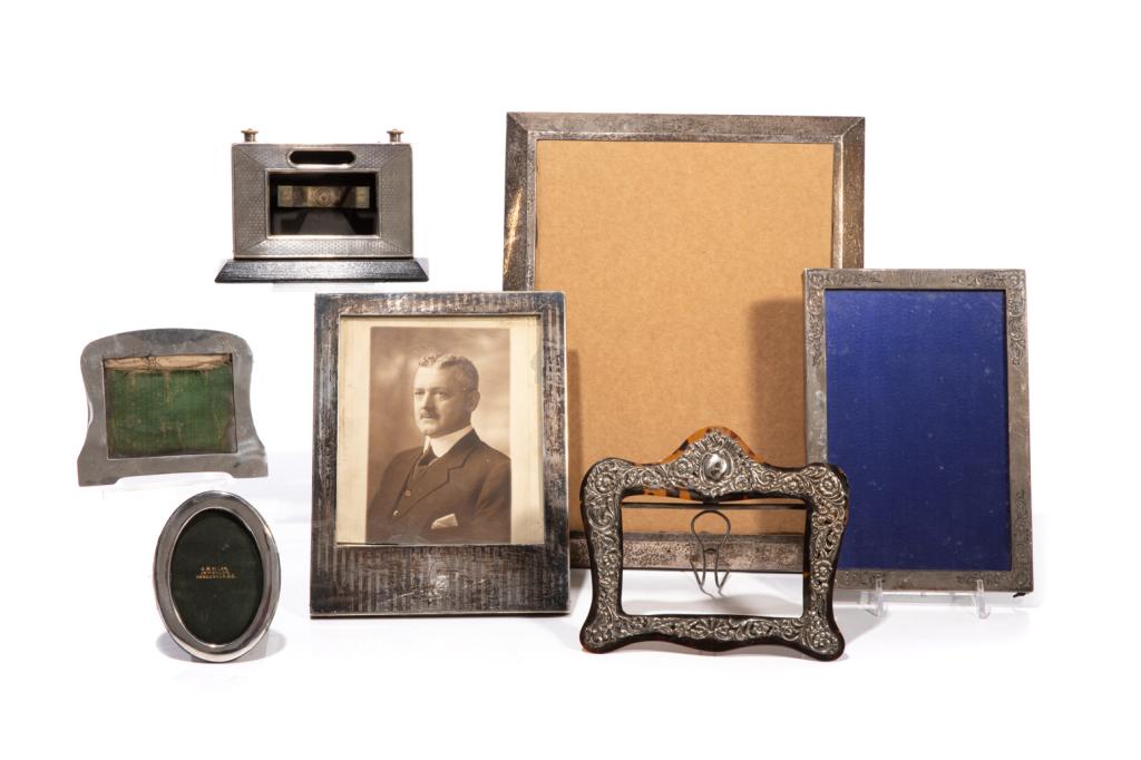 QUANTITY OF SILVER PICTURE FRAMES: Seven sterling silver English and American picture frames. Height of largest: 32 cm (12.5 in.)