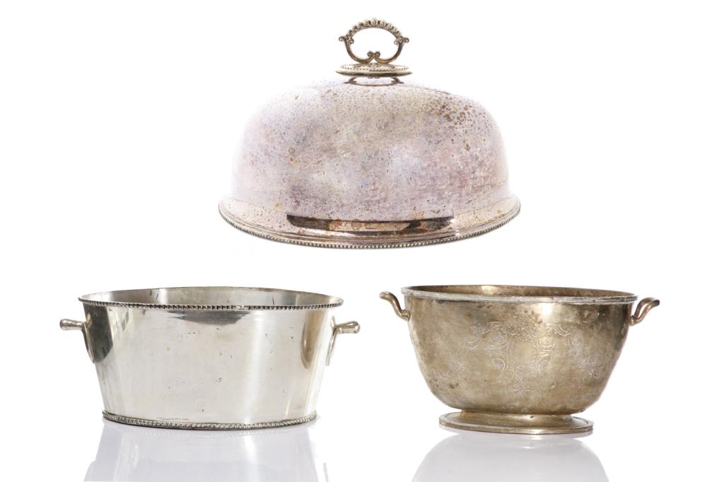 GROUP OF THREE SILVER PLATE TABLE ACCESSORIES: Comprising a meat dome with beaded trims and handle, together with two large wine coolers H. of meat dome 33 cm (13 in); W. 52 cm (20 1/2 in) Largest cooler H. 18 cm (7 1/8 in); W. 39 cm (15 3/8 in)