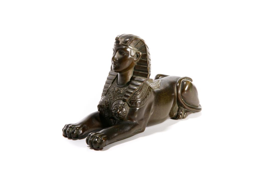 ANTIQUE BRONZE SPHINX CLOCK TOPPER: In traditional form, most likely originally the affixed to the top of a clock. L. 20.5 cm (8 in.)