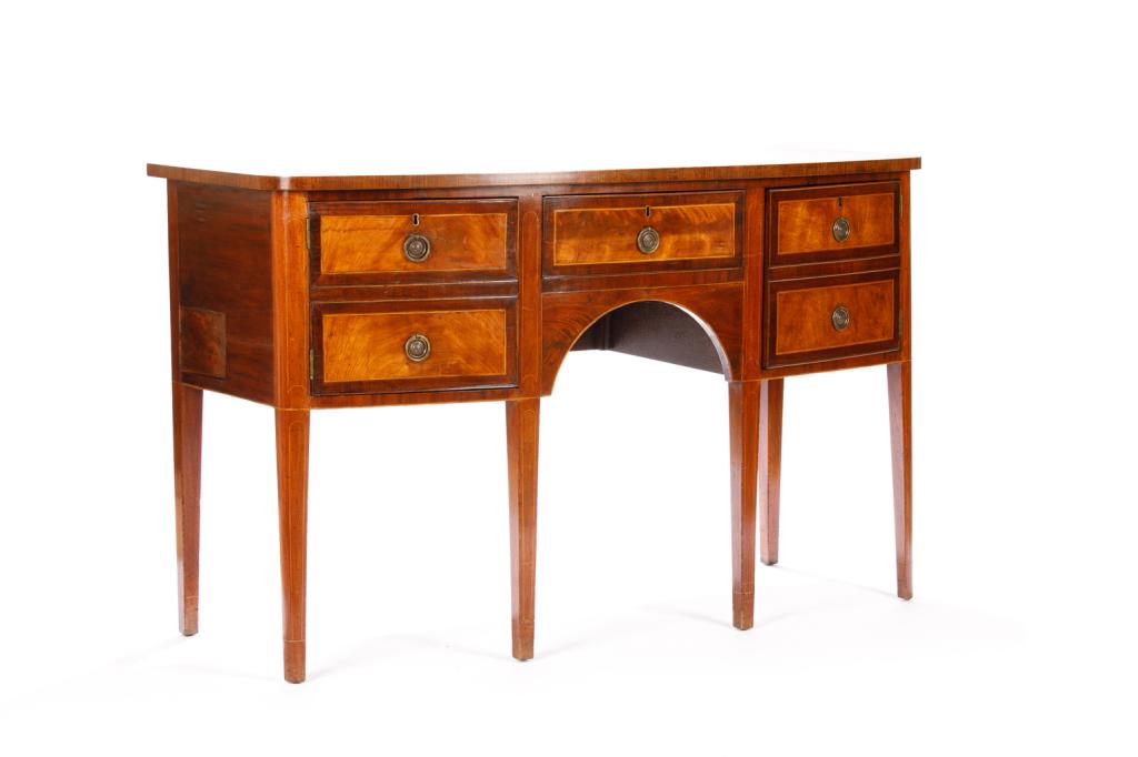 GEORGIAN MAHOGANY SIDEBOARD: With two doors (faux shelves) on the outer edges and a central pull out drawer, in mahogany with satinwood banding and oak secondary wood.H. 37 W. 60 D. 25 1/2 in. Condition report available upon requ