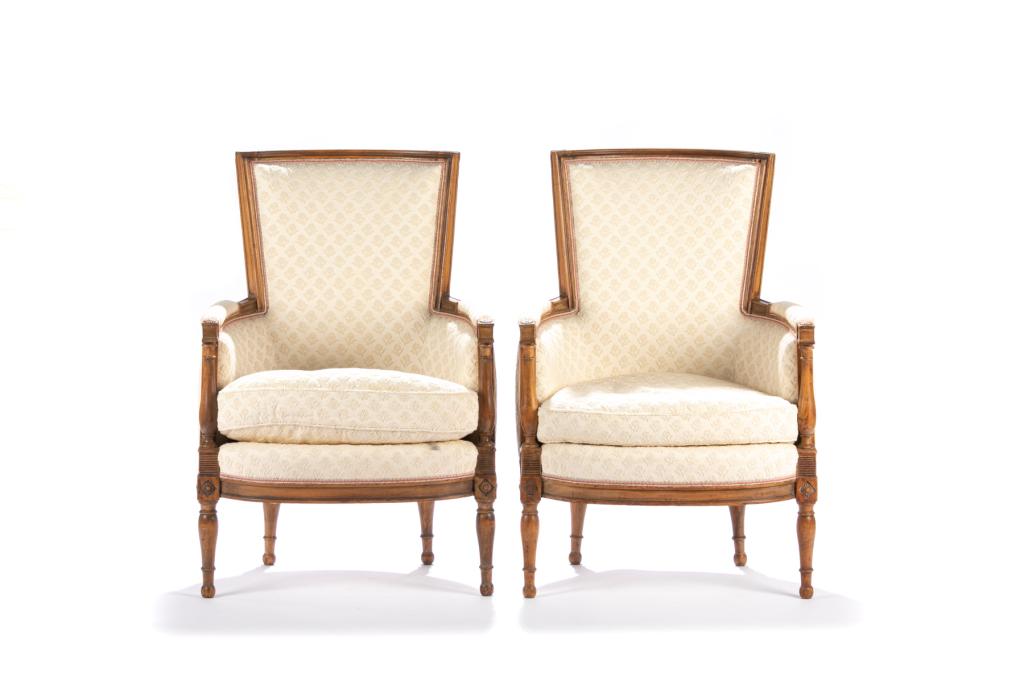 PAIR OF FRENCH UPHOLSTERED BERGERE ARMCHAIRS: Cream coloured upholstery with applied chenille flower pattern, down filled cushions, pink and white gingham upholstered backs with matching trim. Fruitwood frames.H 37 3/4 x W 25 1/4 x D 26in