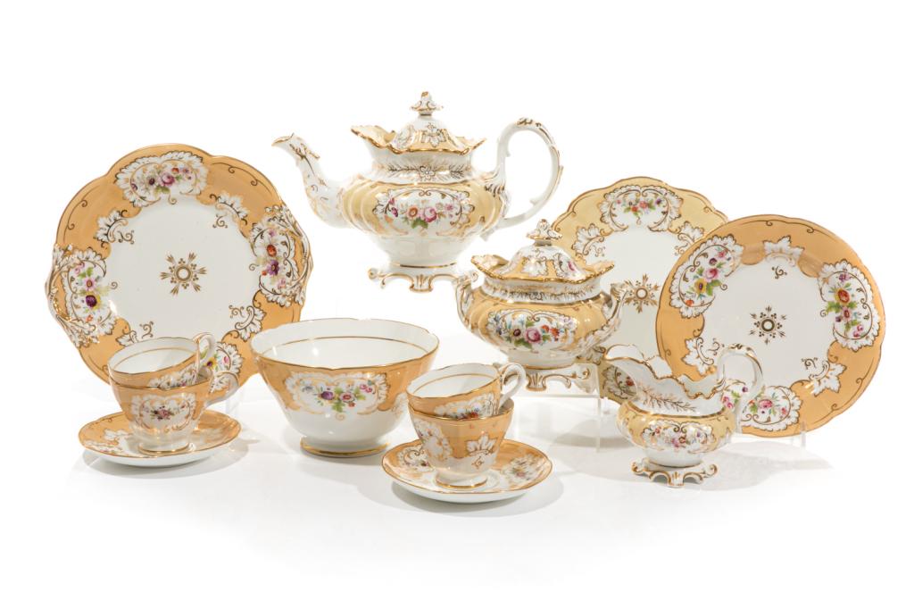 19TH C VICTORIAN PORCELAIN TEA SERVICE: Likely English, possibly by Rockingham. White ground porcelain tea set with yellow bands, gilded accents and hand painted floral motifs throughout. Unmarked. Set is comprising:Tea pot, covered sugar b