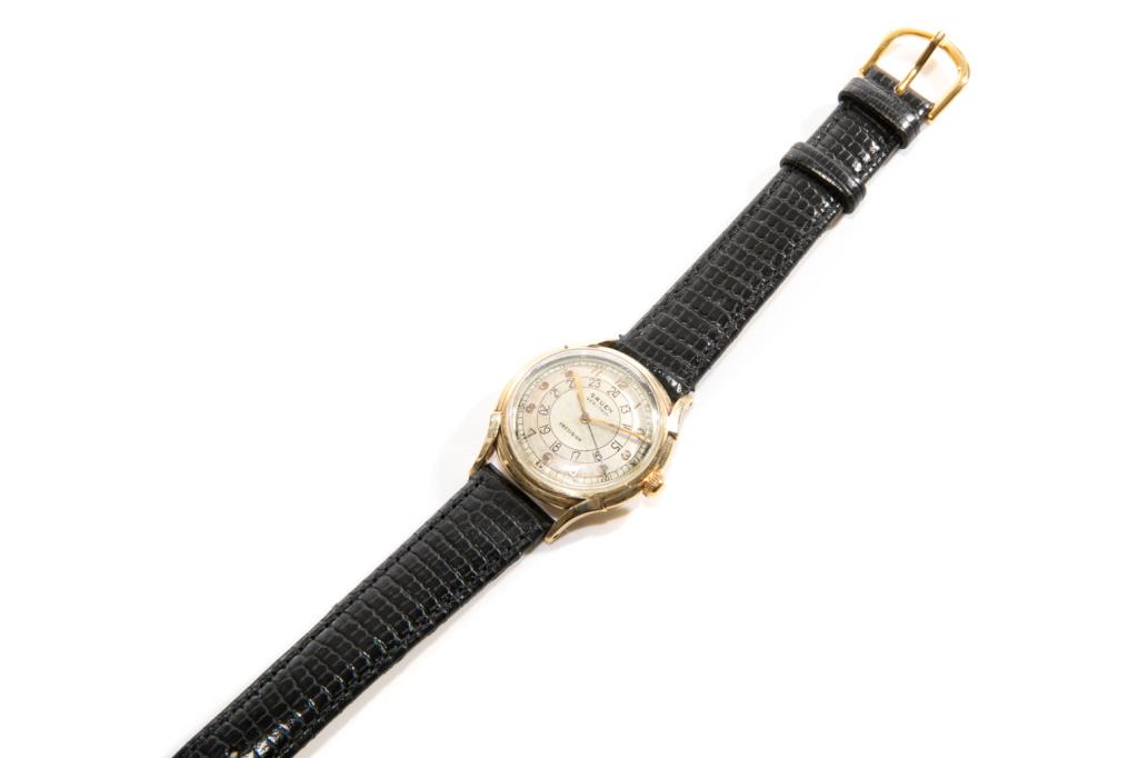 VINTAGE GRUEN GOLD WRISTWATCH, 31g: Man's wristwatch with gold casing, marked 14k. Face marked "Gruen Veri-thin Precision". On a black embossed leather strap. Strap not original. Weight: 31g