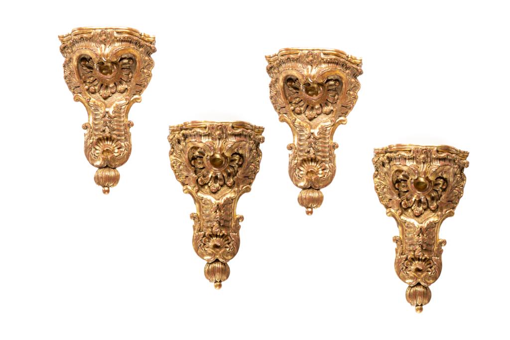 FOUR CARVED GILT WOOD WALL BRACKETS: Gessoed gilding with foliate decoration. Probably Italian, 19th C. H. 15 1/2" W. 9 3/4" D. 5"