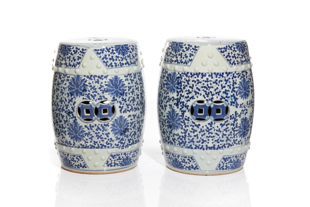 PAIR CHINESE BLUE & WHITE PORCELAIN GARDEN STOOLS: Two Chinese blue and white porcelain drum-shaped garden stools with overall floral motif. H. 19" (48 cm) D. 11 1/4" (28 1/2 cm)