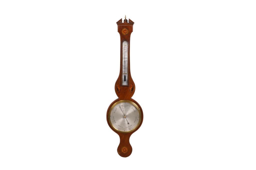 GEORGIAN WALL BAROMETER: A mahogany wall barometer and thermometer with inlaid banding and shell motifs. Label to reverse: "P. A. Oxley Antique Clocks The Old Rectory CHerhill, Nr. Clane Wiltshire SN11 8UX." H. approx. 96.5 c