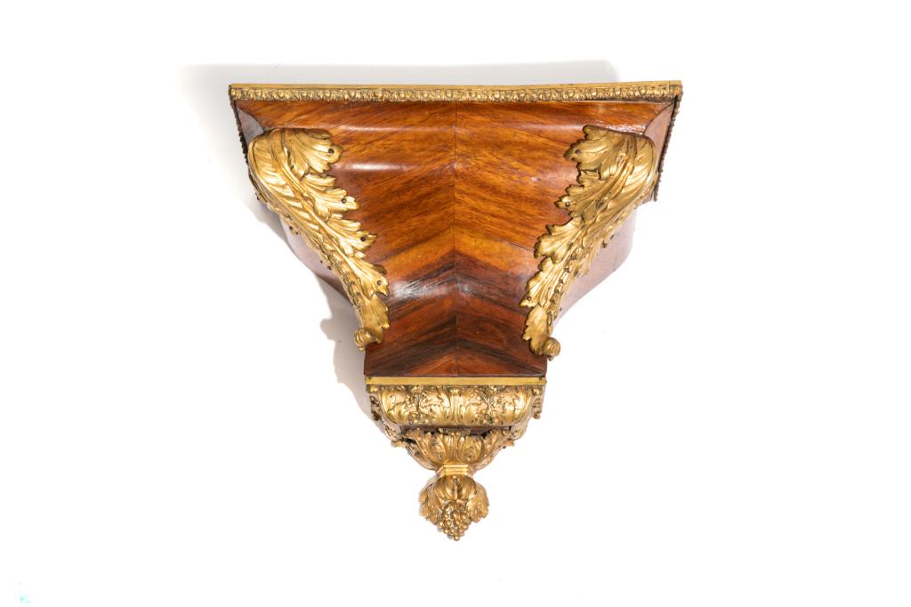 ANTIQUE KINGWOOD CLOCK BRACKET WITH BRONZE MOUNTS: Wood casing with applied ormolu mounts in Louis XVI style. French, 19 C. H. 15 3/4" (40 cm) W. 16 " (40.5 cm) D. 7 3/4" (19.5 cm)