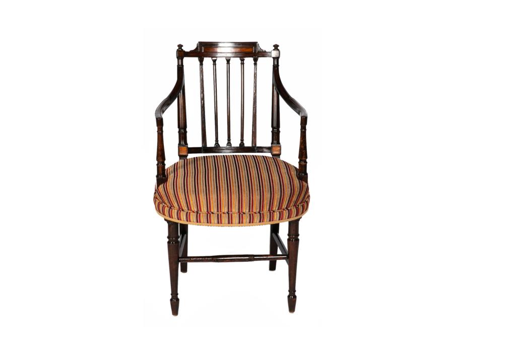 GEORGE III ENGLISH MAHOGANY ARMCHAIR: With satinwood embellishment, curved arms, slat back, and baluster straight legs with stretchers. Contemporary striped upholstery. English late 18th century. H. 34" W. 20 1/4" Provenance: The Estate o