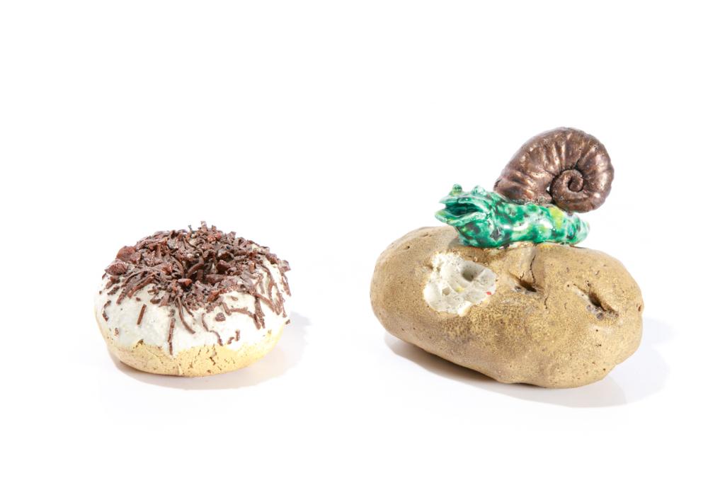 GILHOOLY, DAVID (American, 1943-2013): Two art studio pottery sculptures, dating 1970's. Including a chocolate sprinkled donut, together with a snail on a baked potato. Each signed on underside, potato is dated 1977. H. of largest (snail) 