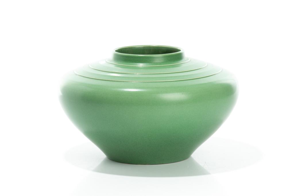 LARGE WEDGWOOD VASE BY KEITH MURRAY: English, c. 1940. With green slip, squat form and concentric circular bands extending from rim along shoulder. Impressed makers mark and signature to the underside. H. 16 cm (6 1/4 in) Dia. 27 cm (10