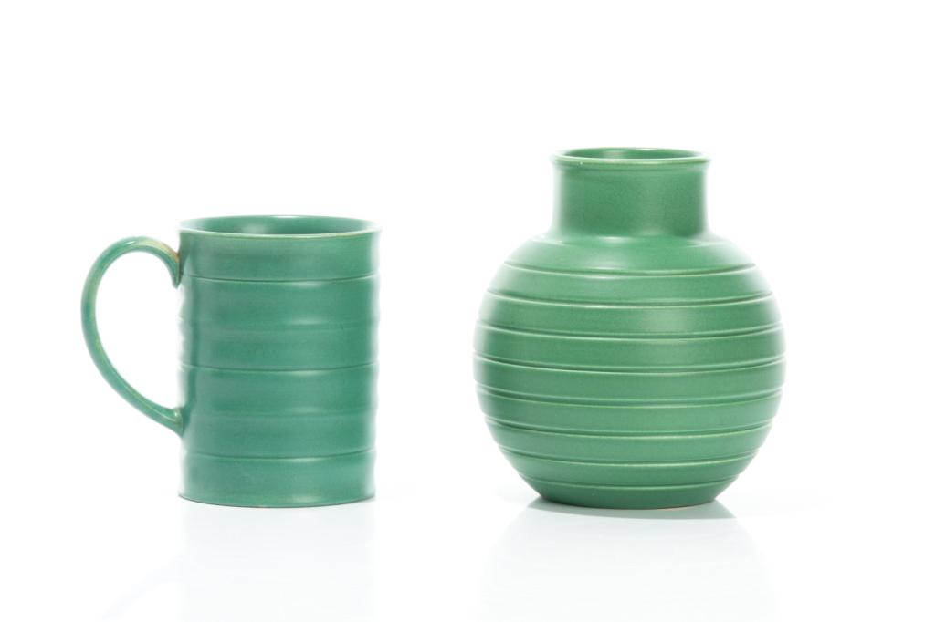 TWO WEDGWOOD POTTERY PIECES BY KEITH MURRAY: English, early/mid 20th century. Comprising a mug and small bulbous vase, each with makers marks and signature on the underside. Vase mark on underside reads 'Keith Murray Wedgwood Made in England Mat