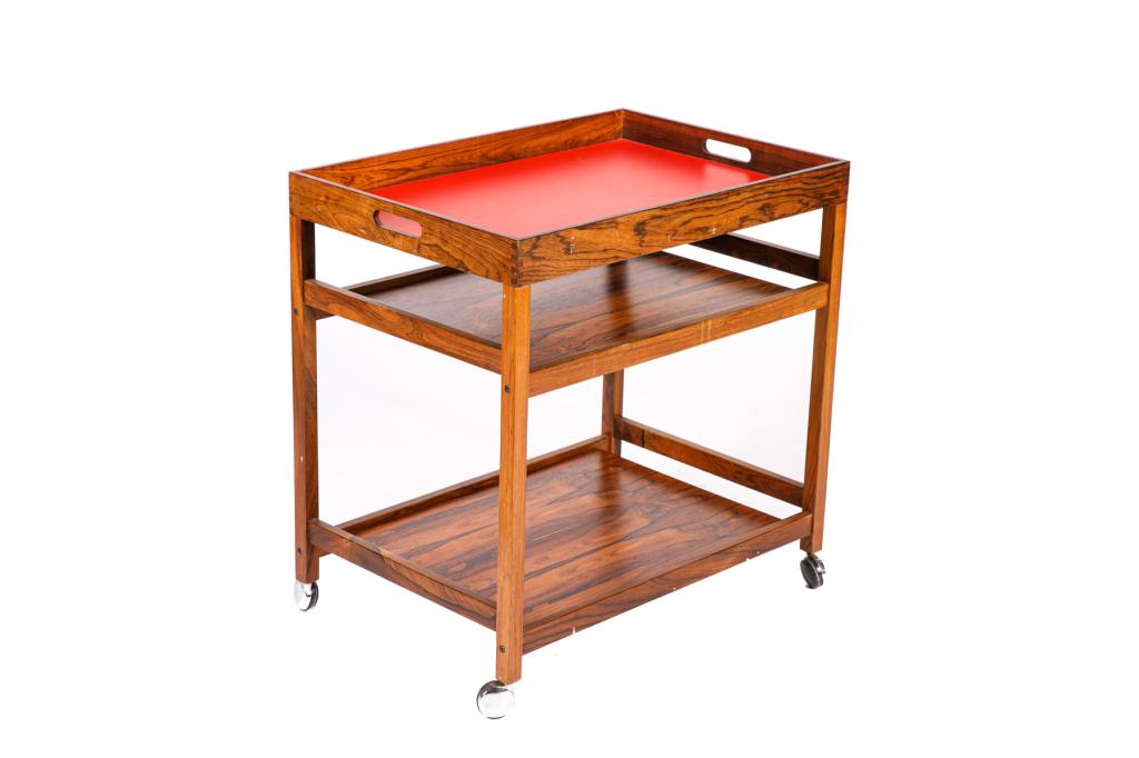 DANISH MID CENTURY ROSEWOOD BAR CART: Three-tiered cart on casters. Top level has a red formica base and is a removable drink tray. Maker's mark on underside with "Made in Denmark". Mid-20th c. H. 27 1/2" W. 27 1/2" D. 18 3/4" Bidders liv
