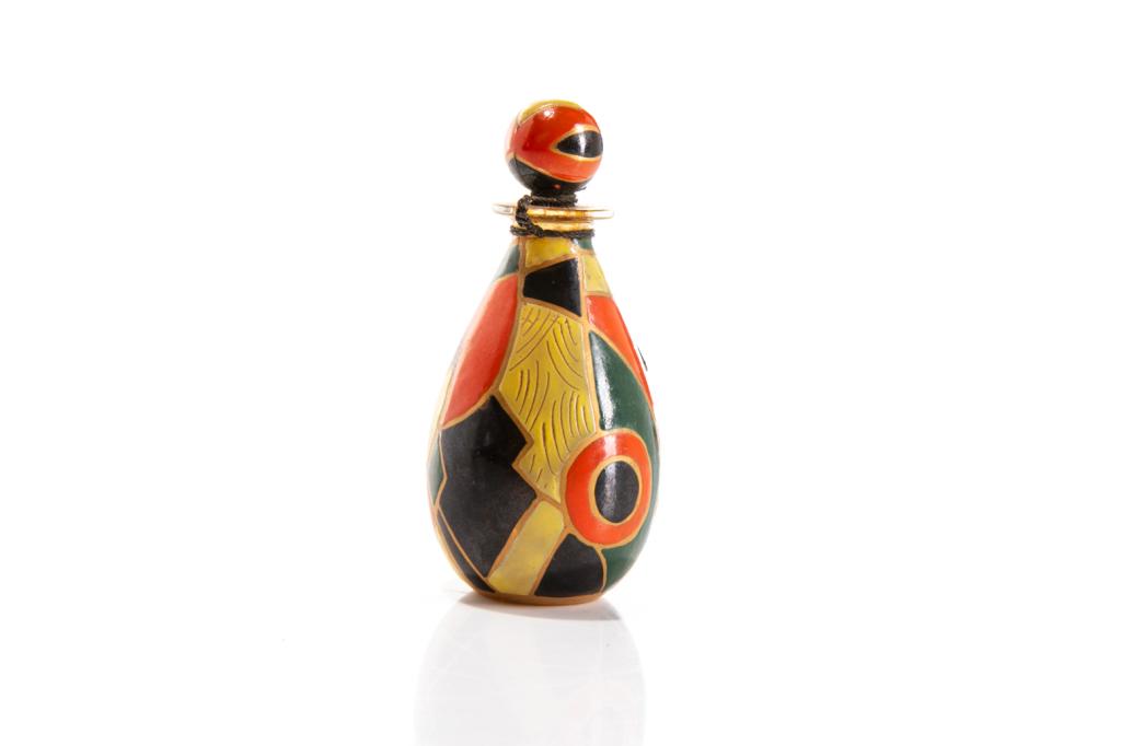 ART DECO GLASS & ENAMEL PERFUME BOTTLE: With original round stopper sealed in place. Bold enamel pattern surrounding the bottle in orange, yellow, green & dark blue, divided by gilded trims. Partially remaining sticker, Jasmine of Southern