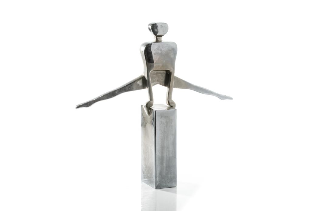 DOLBI CASHIER MODERN CHROMED GYMNAST FIGURE: Chromed metal With foil label to base copyright 1987 H: 17.75"