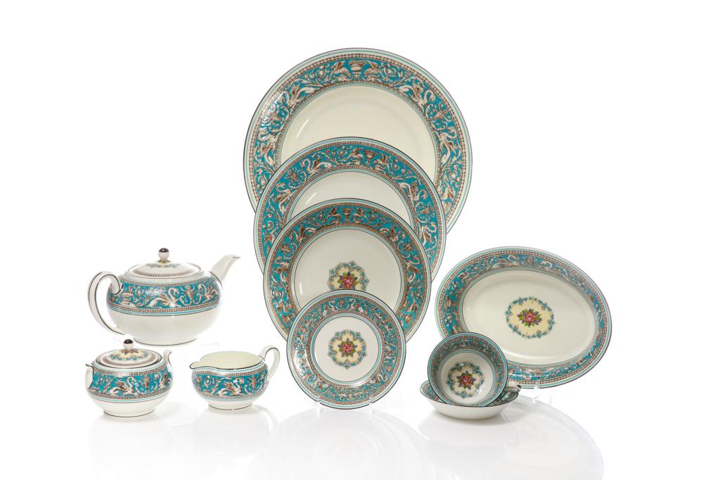 WEDGWOOD FLORENTINE 34 PC PORCELAIN DINNER SERVICE: English, 20th century. White ground porcelain dishes with turquoise rims surrounding pale brown dragon design and fruit center. Makers mark to the underside of each piece. Set is comprising: Six cups