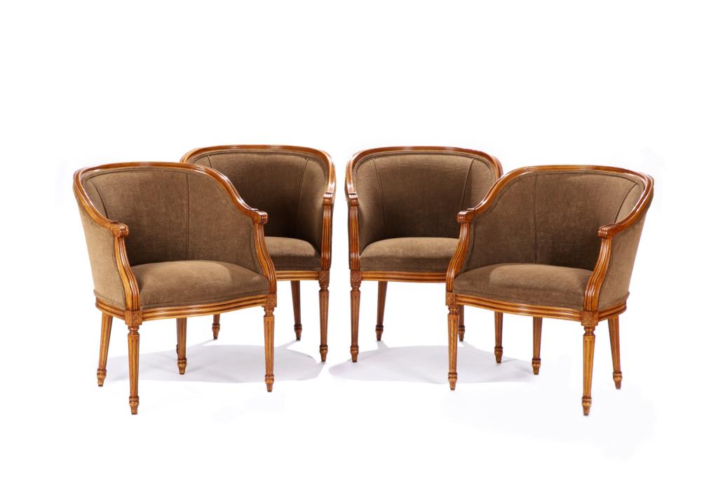 FOUR UPHOLSTERED TUB CHAIRS: Brown upholstery with matching piping in a French-style carved wood frame. 20th C. H. 32" W. 25 1/2" D. 24"