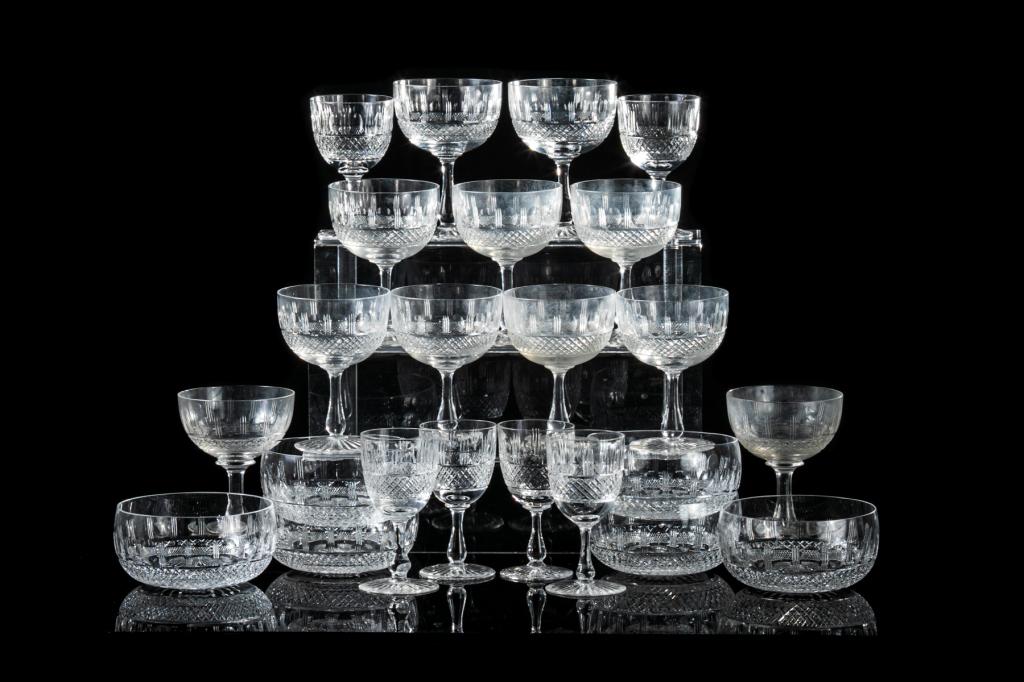 23 PIECES ASSORTED CUT GLASS STEMWARE: Including eleven champagne coupes, six liqueur glasses (two sherry and four cordial), and six rinsers. Four smaller liqueurs signed for Edinburgh, Scotland; remainder unsigned. H. of champagne: 12.1 c