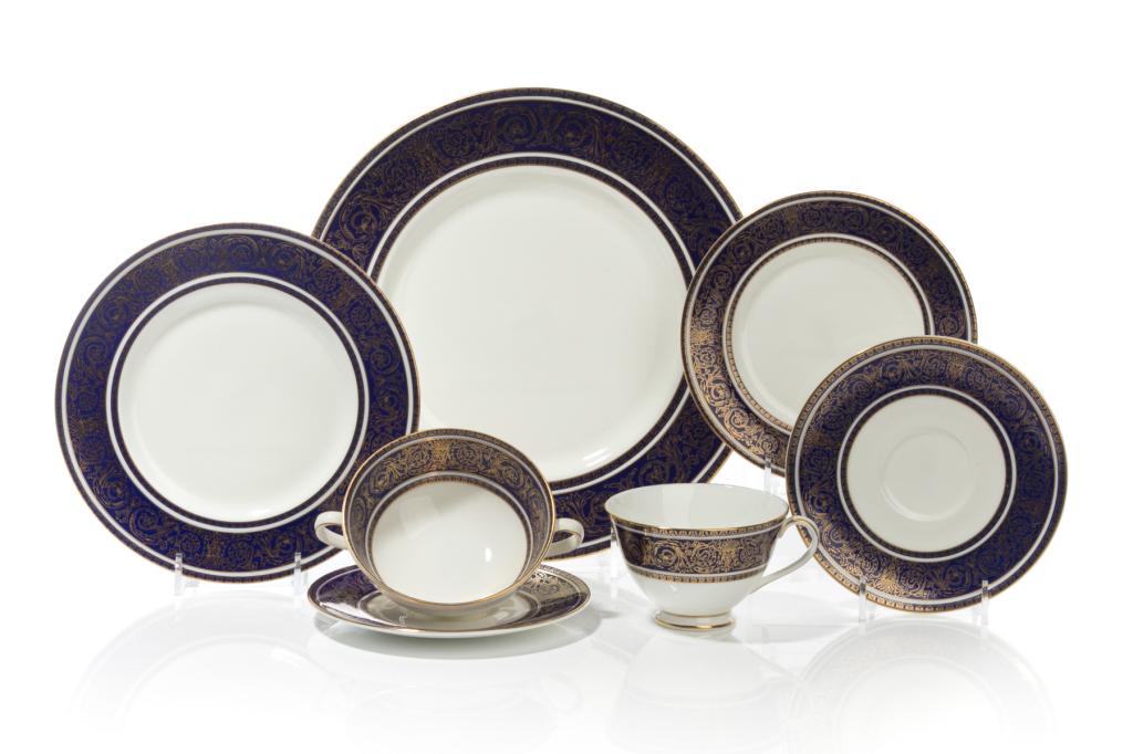 42 PIECES ROYAL DOULTON IMPERIAL BLUE PORCELAIN: An Imperial Blue fine china service by Royal Doulton (H4996) with gilded filigree on a cobalt blue band, Comprising ten dinner plates, ten salad plates, eight bread and butter plates, six footed soup 