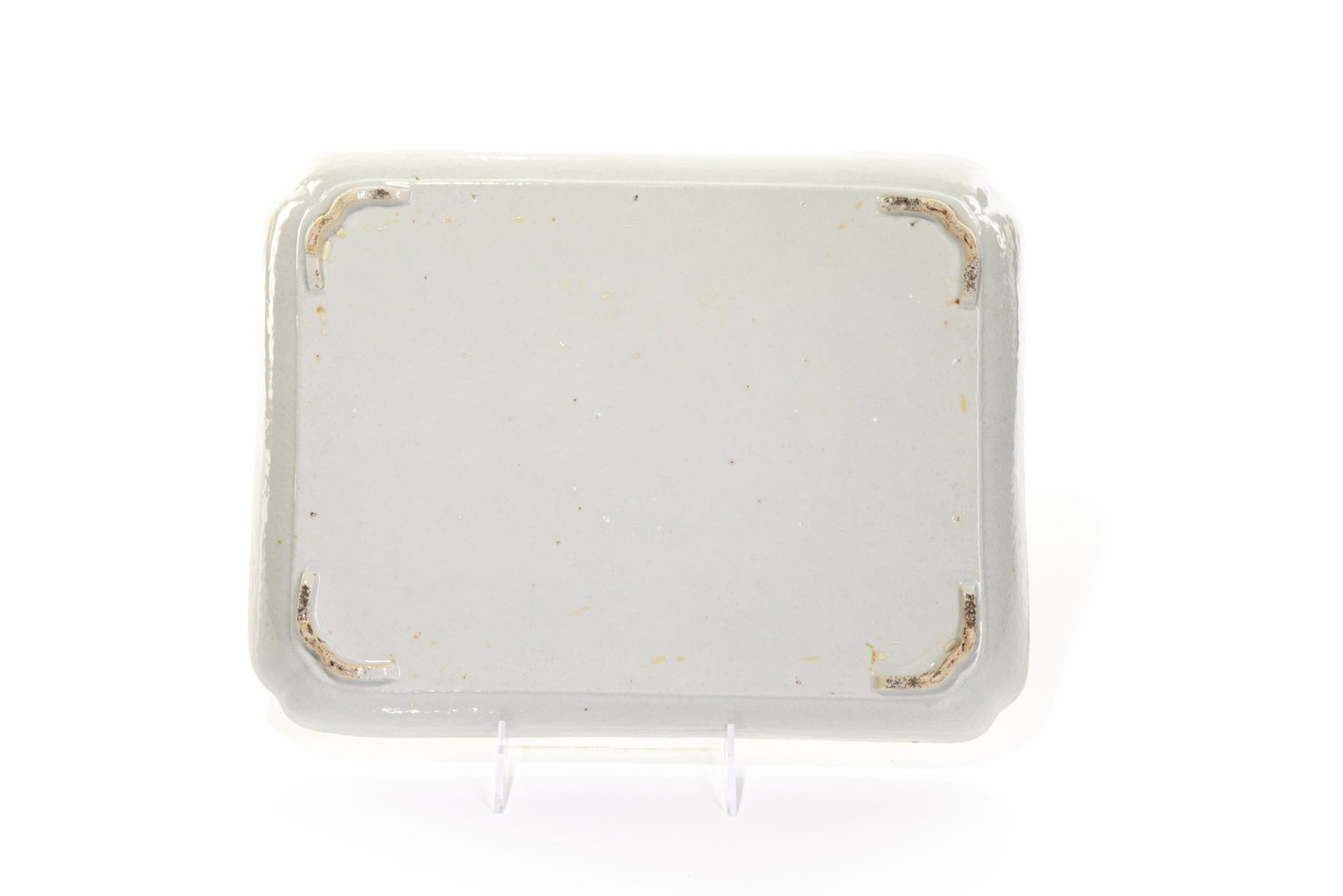 CHINESE EXPORT FAMILLE ROSE 'ROCKEFELLER' DISH: Rectangular porcelain dish painted with scholar officials playing games in a house garden with landscape in the distance. Gilt border with grisaille landscape scenes. Qing dynasty, circa 1810. Size: 3