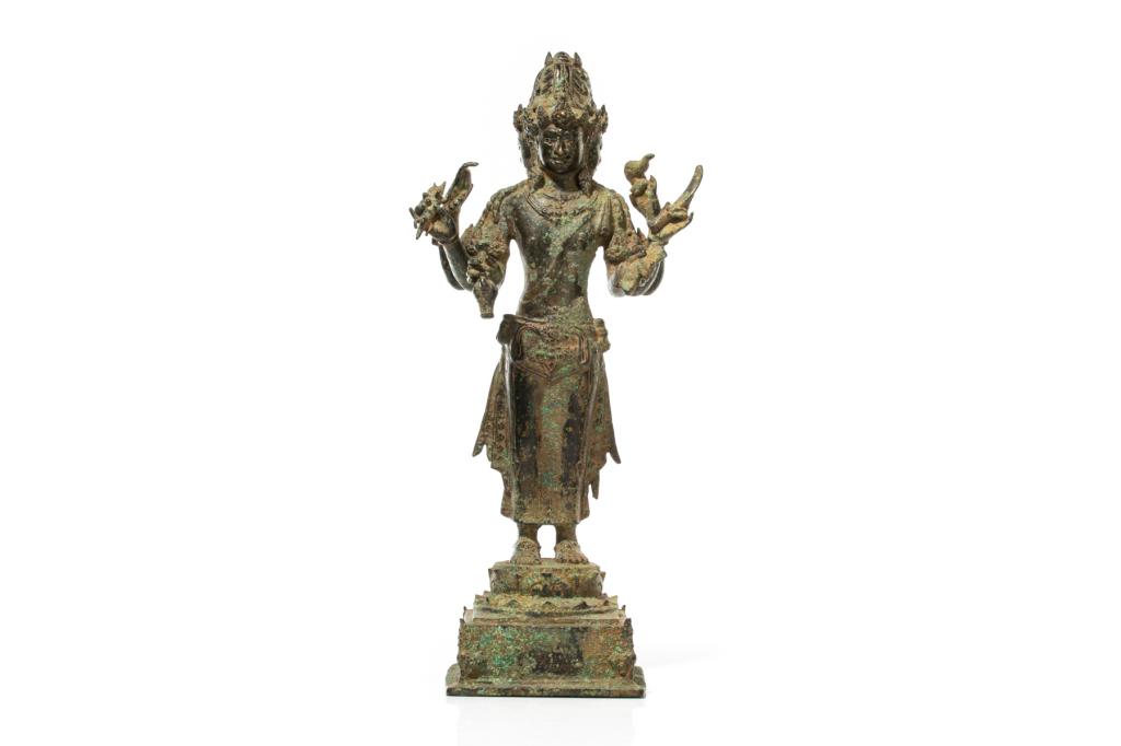 INDONESIAN BRONZE AVALOKITESHVARA FIGURE: The three-headed and six0armed figure holding a ritual implement in each hand, and standing on a circular lotus base atop a square platform. 11th C. Accompanied by Oxford labs test result. H. 45cm (17