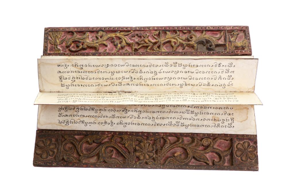 BURMESE BUDDHIST KAMMAVACA MANUSCRIPT ALBUM: Carved and painted wood cover accordion album, ink on paper manuscript. Size: 58 x 10 x 5cm (22 3/4 x 4 x 2 in.)