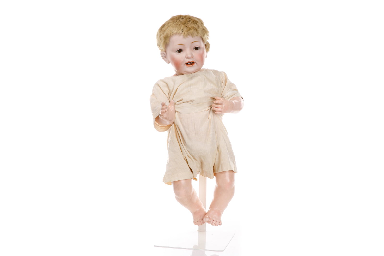 ANTIQUE JD KESTNER CHARACTER BABY DOLL: Laughing (Baby Jean) baby doll with swivel socket bisque head, sleepy brown glass paperweight eyes, painted feathered lashes and brows, open mouth with bottom teeth, blonde caracul wig. On composite b