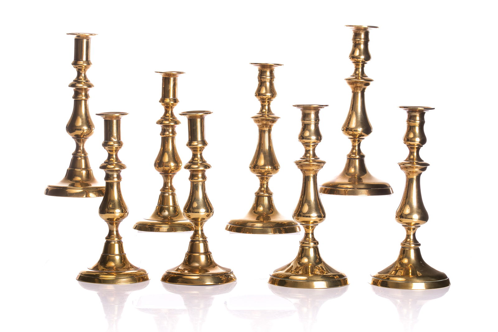 FOUR PAIRS OF GEORGIAN BRASS CANDLESTICKS (1 of 2)
