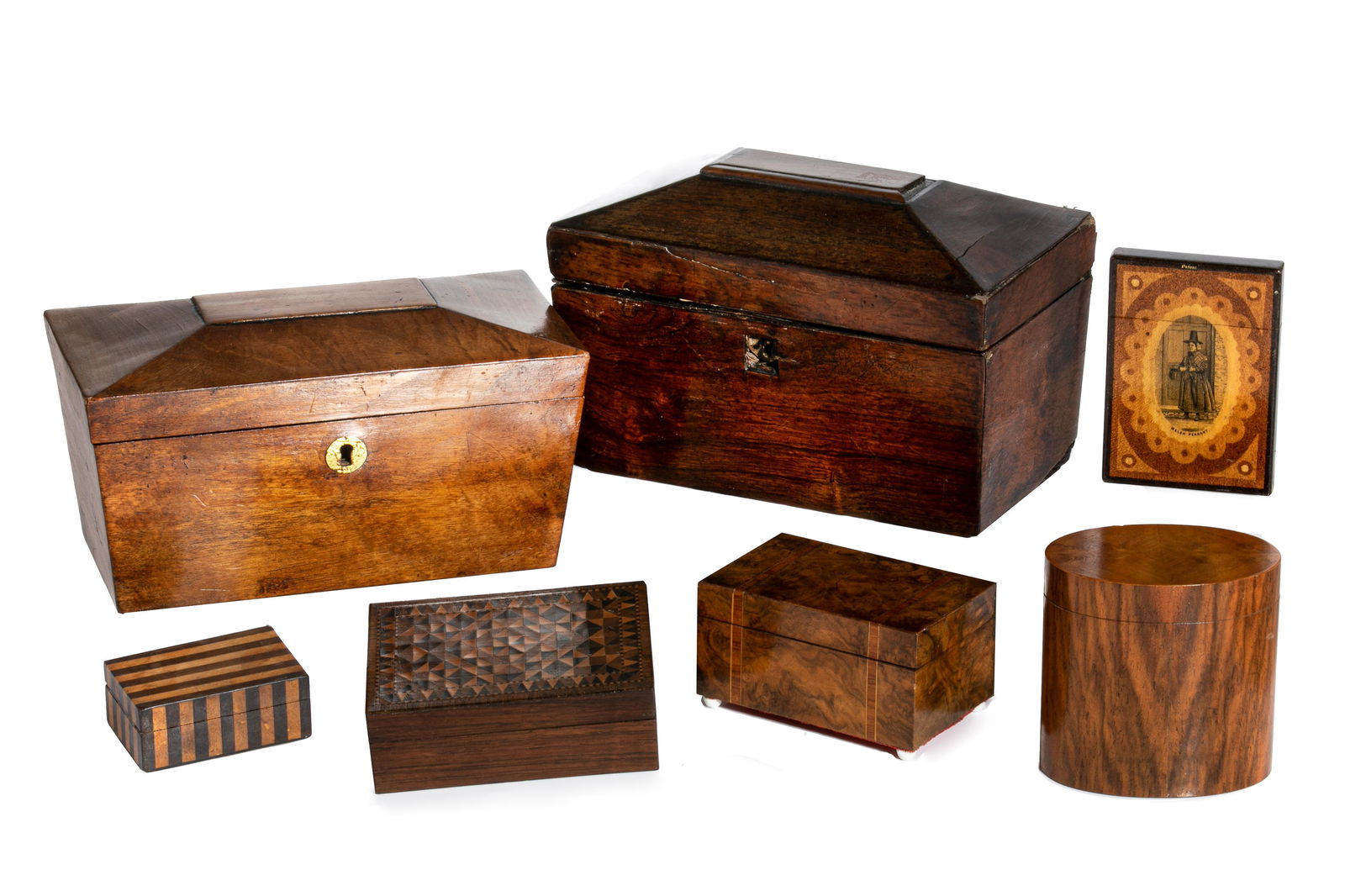 GROUP OF ENGLISH TEA CADDIES & DECORATIVE BOXES: Two sarcophagus form caddies, one is rosewood veneered and one is mahogany veneered. Each open to reveal one open compartment. Together with five small decorative boxes in various specimens of wood, i