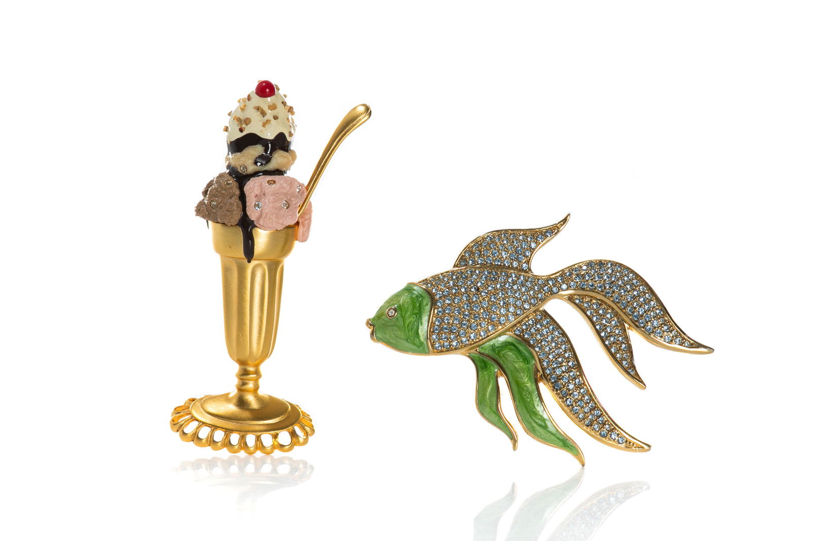 VINTAGE BOB MACKIE & GUY LAROCHE BROOCH: 1980s Bob Mackie Ice Cream Sundae gold-toned brooch. Matte finish with enamel and embellished with rhinestones. Marked "Bob Mackie" on reverse. Gold-toned fish brooch with green enamel and rhinestone