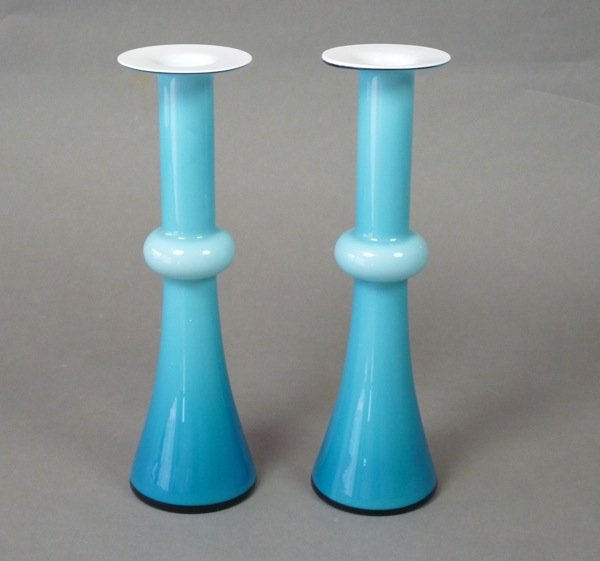 SWEDISH HOLMEGAARD CASED BLUE GLASS VASES: Pair of Swedish Holmegaard cased blue and white glass vases. Molded in a slender flute with central sphere and flared flat rims. Paper labels. H 25.5 cm (10 in).