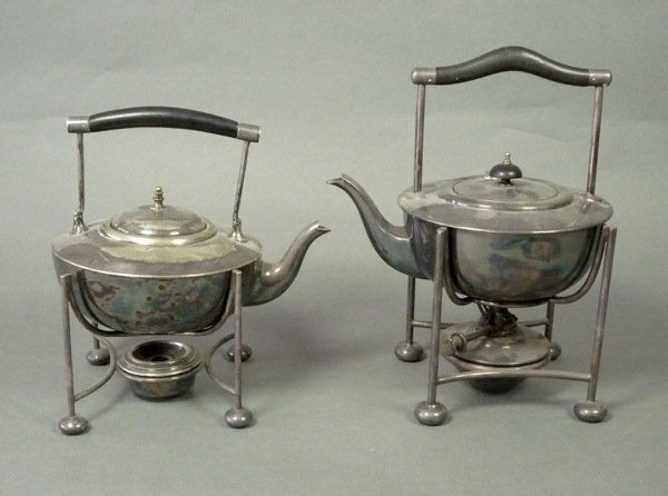 ENGLISH ARTS CRAFTS SILVER PLATED KETTLES DRESSER: Two English arts and crafts silver plate kettles on stands after Christopher Dresser. Makers 'WS&S' and 'D&A'. H 27.5 (10 3/4 in) and H 22 cm (8 5/8 in).