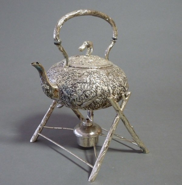 WANG HING CHINESE EXPORT SILVER KETTLE ON STAND: Chinese export silver kettle on stand and burner. The body with profuse bird and prunus decoration with simulated wood base and handle.. Maker Wang Hing. H 25.5 cm (10 in). 902 grams.