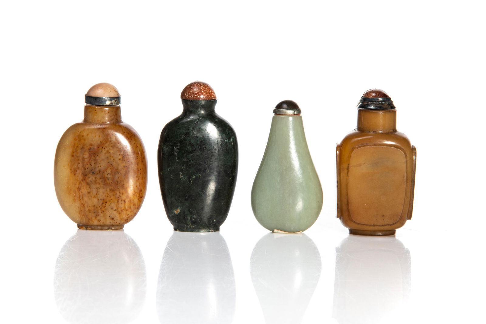 FOUR CHINESE CARVED JADE SNUFF BOTTLES (1 of 3)