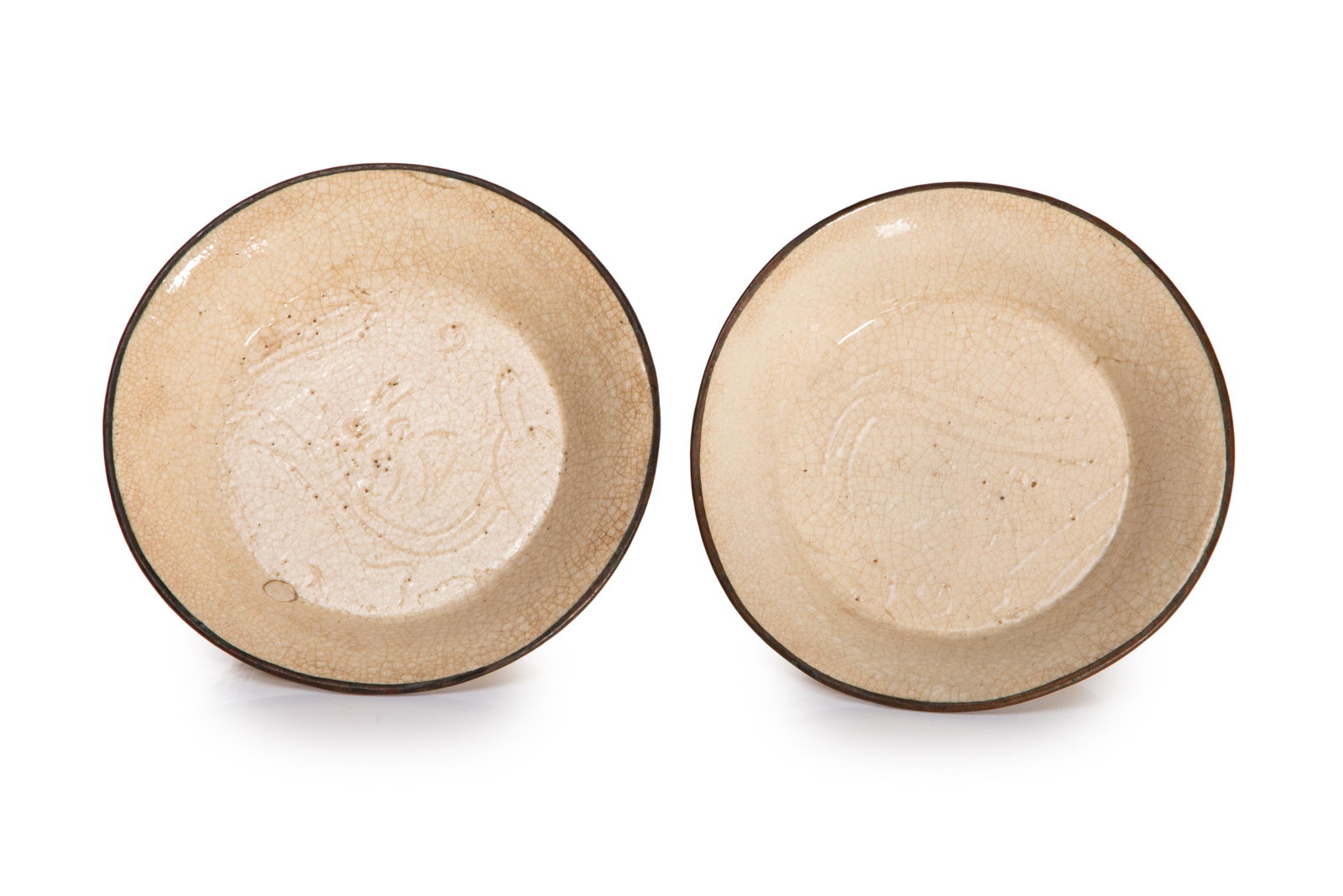 CHINESE EARLY CRACKLED BOWLS WITH METAL RIMS: Chinese, possibly Song dynasty, each having dark cream glazed body with overall crackle, and incised swirls in centre, with high, slightly flaring sides, metal rim. Cut-in foot rim, with incised ring 