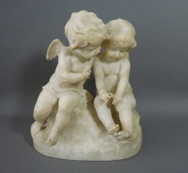 GUGLIELMO PUGI MARBLE SCULPTURE OF TWO PUTTI: Guglielmo Pugi (active 1870-1915) Italian, early 20th century, inspired by Amor & Psyche, signed Pugi on base, minor repairs and losses. H 42 cm. (16 1.2 in.).