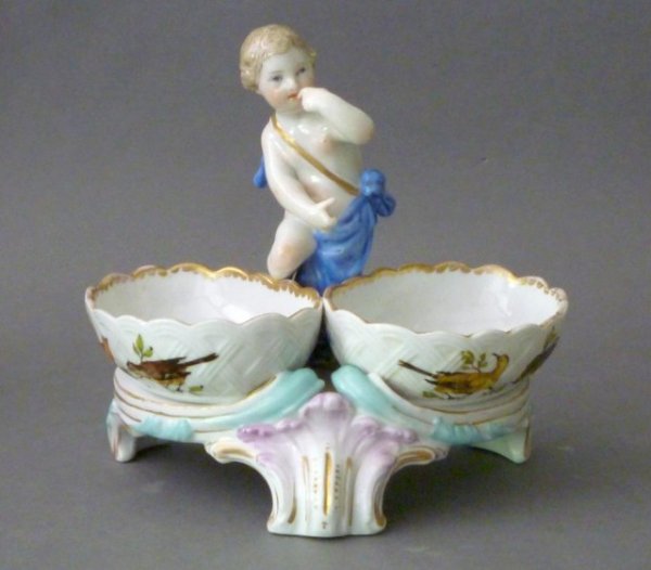 KPM BERLIN PORCELAIN FIGURAL SALT: KPM Berlin hand painted porcleain figural salt with ornithological motif and standing putti, late 19th century.