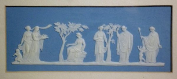 WEDGWOOD 19TH CENTURY JASPERWARE PLAQUE: Wedgwood blue jasperware framed plaque with applied white Grecian women, impressed maker's mark in capitals, 19th century. W 17 cm. (6 3/4 in.)