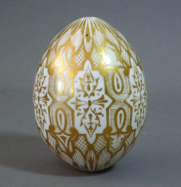 RUSSIAN IMPERIAL PORCELAIN EASTER EGG 19TH CENTUR: Russian Imperial porcelain Easter egg with ornate gilt decoration, mark of Nicholas I, 1825-1855. H 9 cm. (3 3/4 in.)