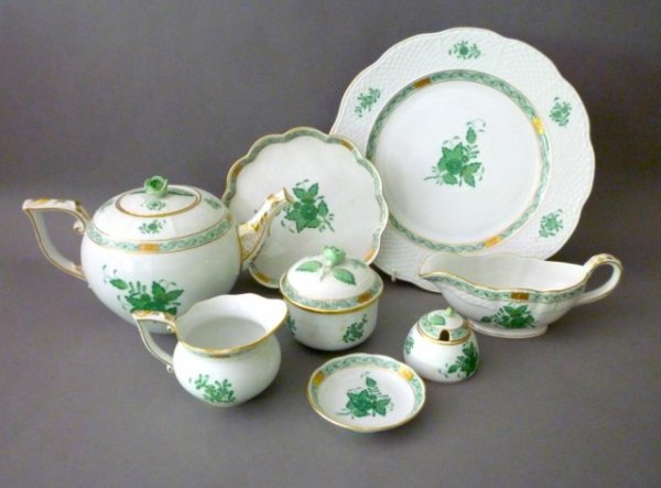 HEREND GREEN CHINESE BOUQUET PORCELAIN DINNERWARE: Twenty-three pieces of Herend green Chinese Bouquet porcelain including 12 dinner plates, 4 nut dishes, a lobed small tray, three piece tea set, honey pot, and two gravy boats.