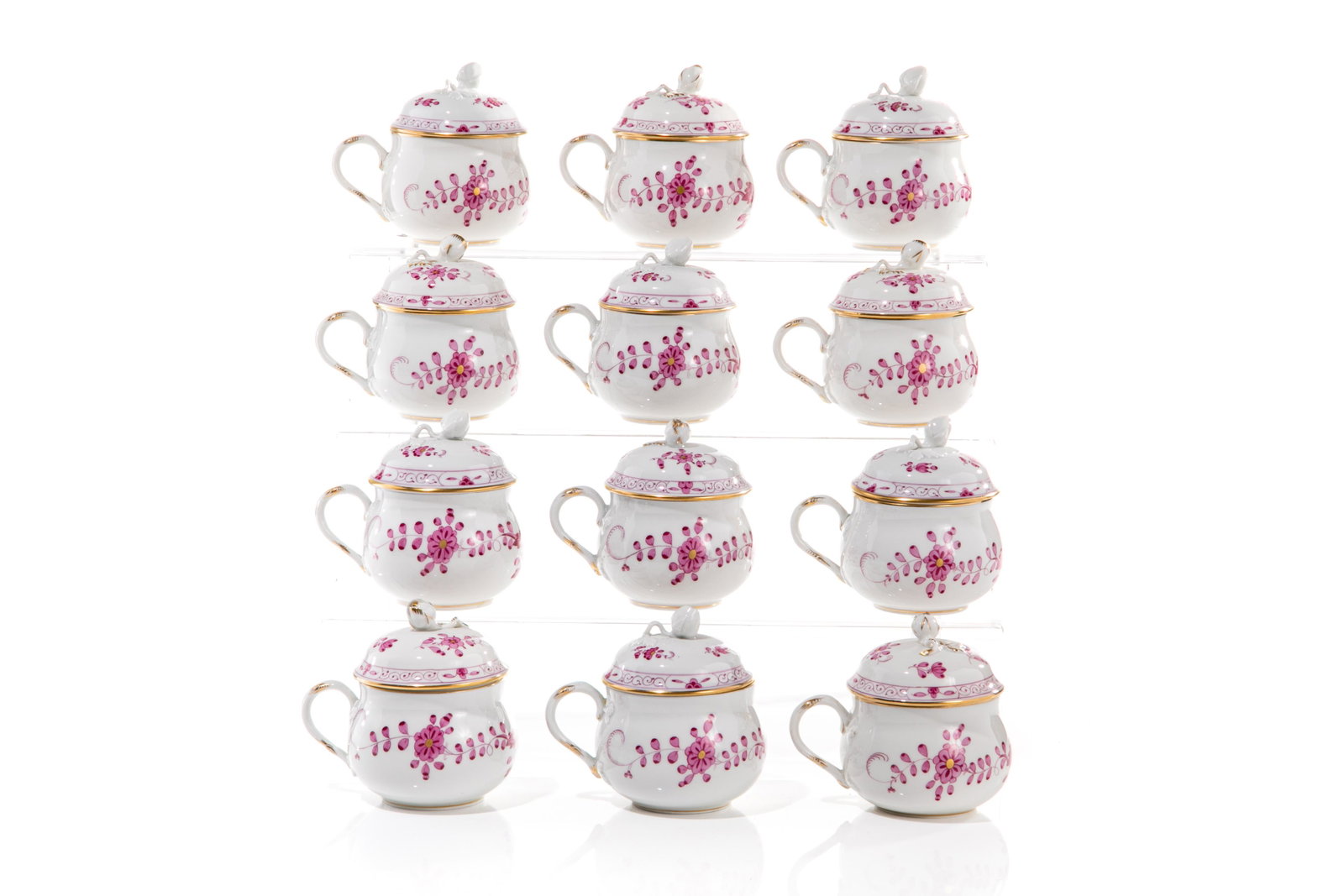 TWELVE MEISSEN PINK INDIAN BOUILLON CUPS WITH LIDS: Cross Swords marks, second grade. Dia 6cm (2.5in) 6 finials with gilding, 6 without.