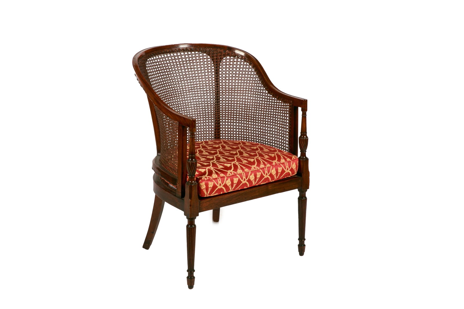 REGENCY STYLE MAHOGANY ARMCHAIR: With shaped and fluted supports and caned upholstery, probably Edwardian, early 20th C. H. 33 1/2" W. 24" D. 25"