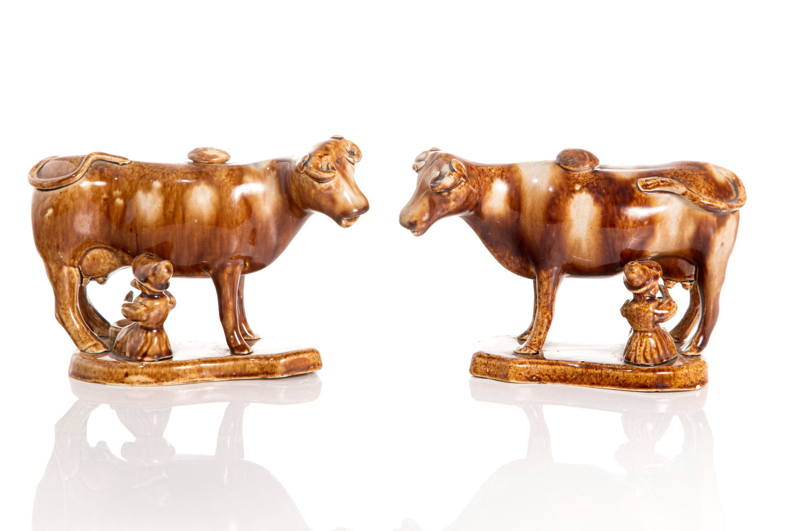 PAIR OF 19TH C STAFFORDSHIRE COW CREAMERS (1 of 3)