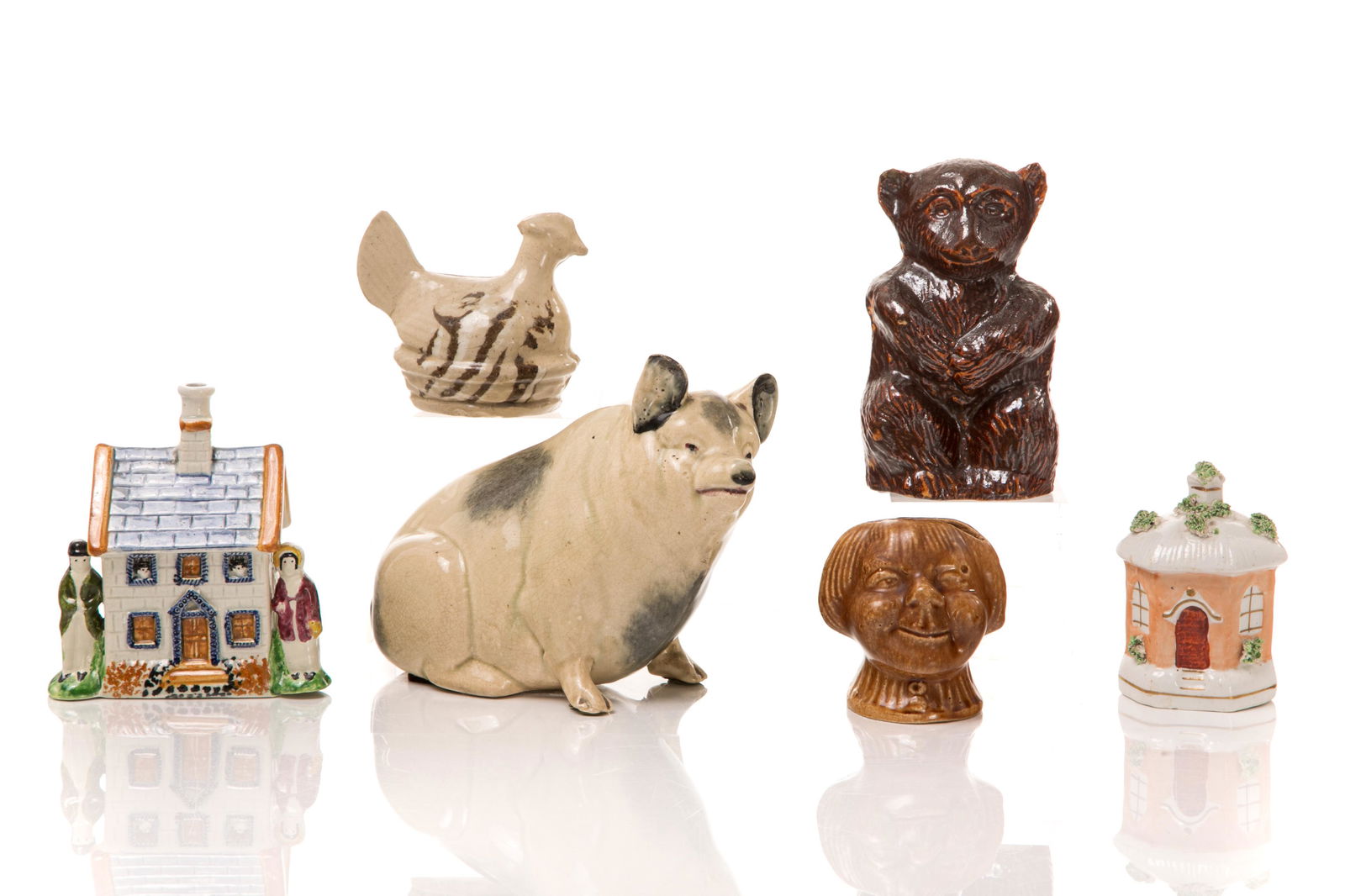 SIX ANTIQUE POTTERY MONEY BANKS (1 of 4)