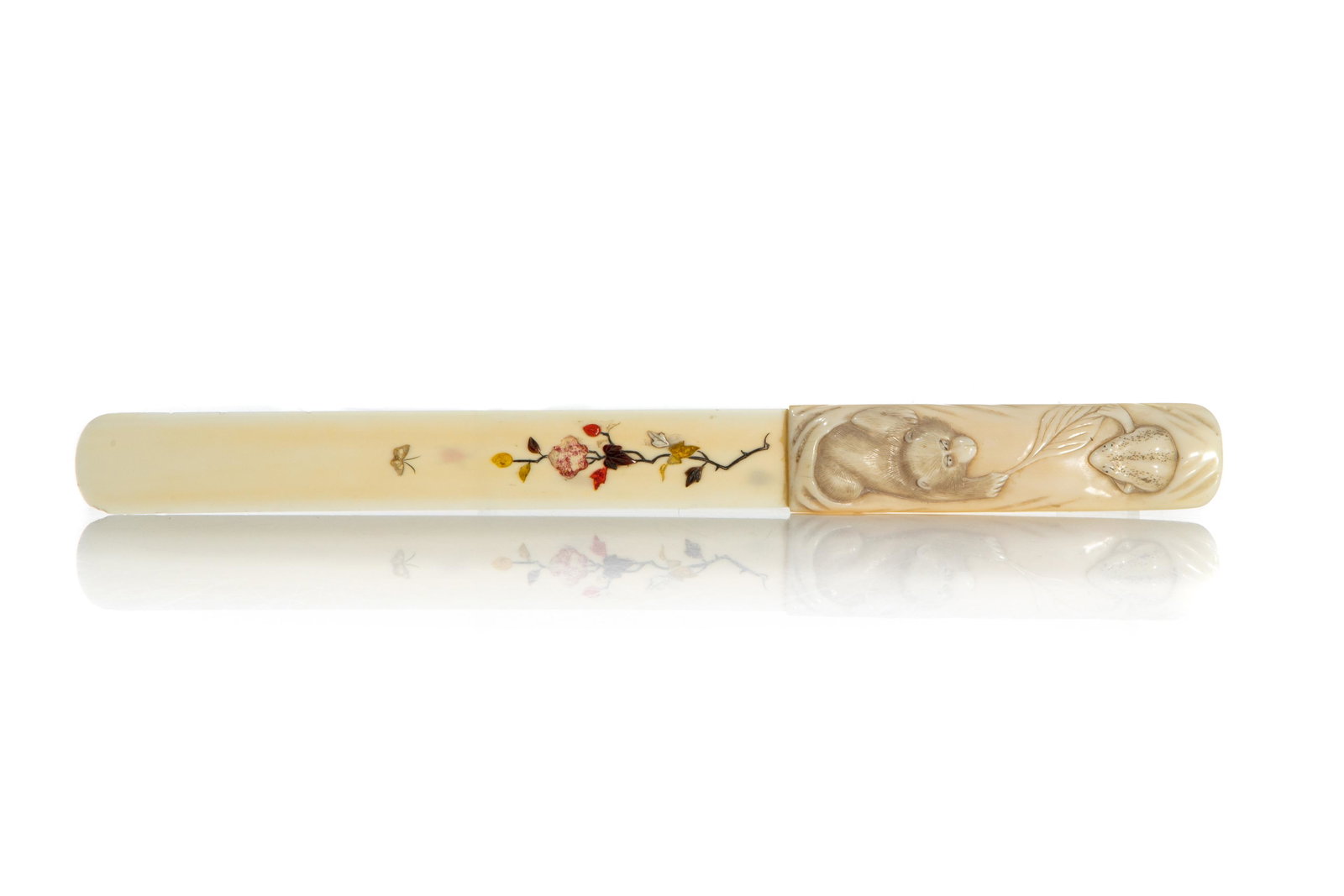 NATURAL LETTER OPENER WITH SHIBIYAMA DECORATION: Japanese, having a handle carved with a monkey playing with a leaf and frog, the blade featuring painted and applied stones of insects. Length: 26 cm (10 1/4 in.) Bidders living outside of Canada are 